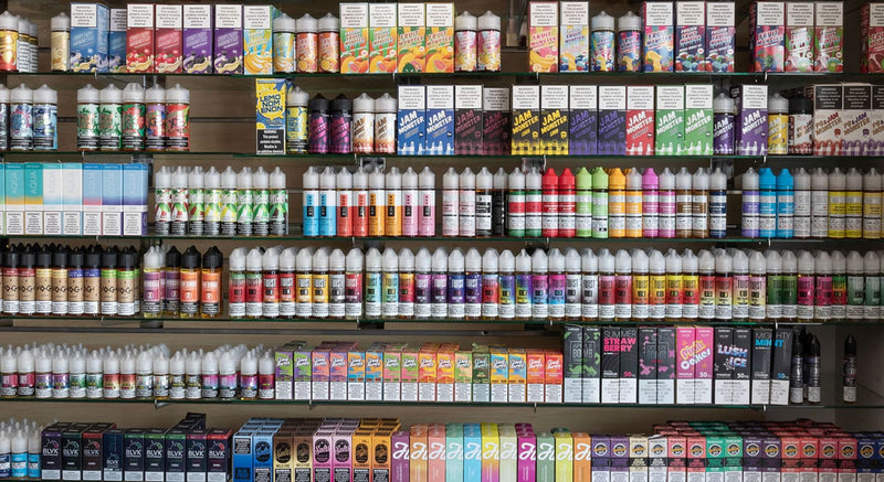 E-liquids on a vape shop shelf - Expired E-liquid vaping guide blog cover.