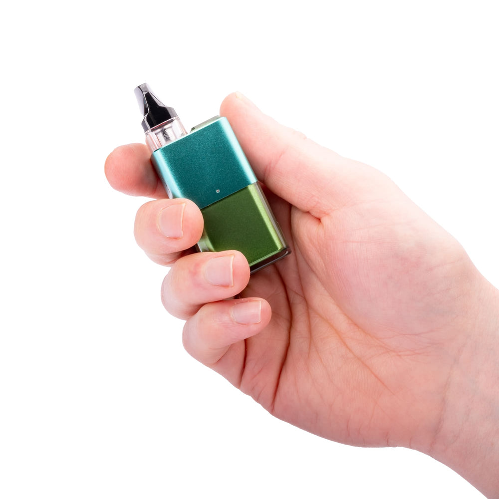 Forest Green Vaporesso Xros Cube in hand.